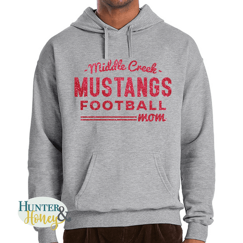 Gray hoodie with red glitter Middle Creek Mustangs Football Mom design. It's a clean and classic old school design.