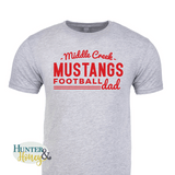 A gray ringspun cotton crewneck tee with a red imprint reading Middle Creek Mustangs Football Dad across the chest.