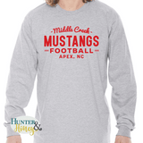 A gray ringspun cotton long sleeve tee with a red imprint that reads Middle Creek Mustangs Football Apex, NC.