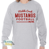 A gray long sleeve ringspun crewneck t-shirt with a red glitter imprint across the chest that reads 