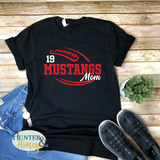 A black short-sleeve crewneck t-shirt with a two-color red and white football with the text of Mustangs Mom running in the middle of the football.