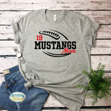 A gray short-sleeve crewneck t-shirt with a two-color black and red football and the text Mustangs Mom running in the middle of the football.