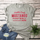 Gray short sleeve t-shirt with red glitter Middle Creek Mustangs Football Mom design. It's a clean and classic old school design.