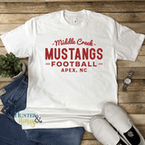 White short sleeve t-shirt with red glitter Middle Creek Mustangs Football Apex, NC design. It's a clean and classic old school design.