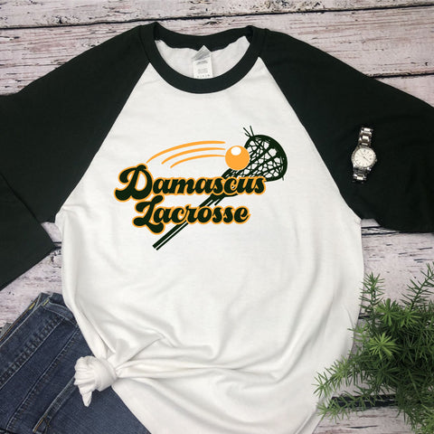 Damascus Lacrosse green raglan sleeve tee with stick and ball design