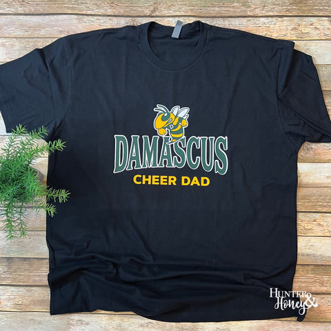 Damascus Cheer Dad black tee with an arched Damascus text and a hornet. It is a three-color graphic on a ring-spun cotton t-shirt.