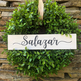 Salazar personalized white and black sign on a faux boxwood wreath