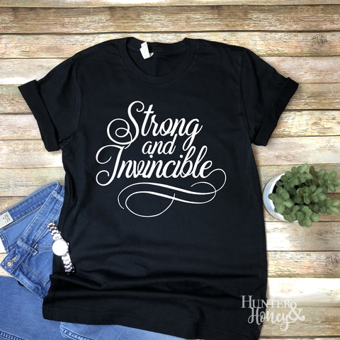 Strong and Invincible black t-shirt with white text