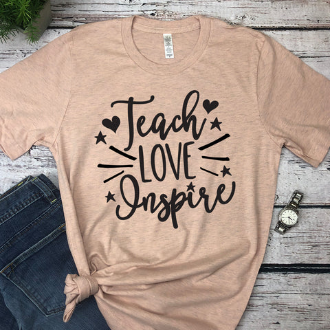 Teach Love Inspire graphic tee in heather peach.