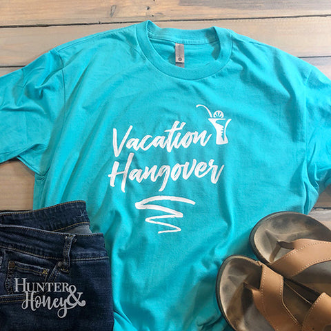 Turquoise blue Vacation Hangover graphic tee with white brush lettering and a cute cocktail.