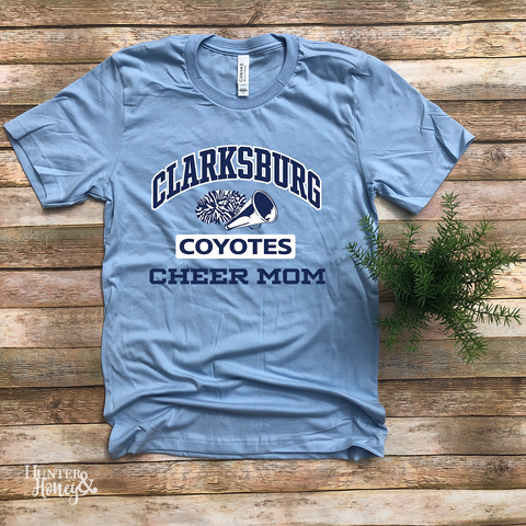 Clarksburg Old School Cheer Mom baby blue t-shirt with megaphone and pom two-color logo.